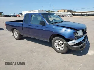 1999 Nissan Frontier XE with VIN 1N6DD26S9XC307893, listed as a Copart auction lot 66045605 with 239,269 mi miles and Salvage title. Bid and sale history available at DreamBid. Image 4.