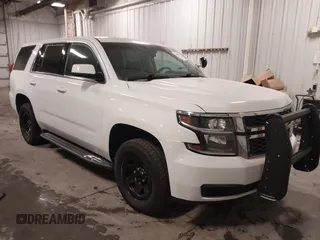 2018 Chevrolet Tahoe Commercial z VIN 1GNSKDEC1JR240868, wystawiony jako IAAI lot #41608806 z przebiegiem 138 126 mil mil oraz . Historia ofert i sprzedaży dostępna na DreamBid. Obrazek 1.