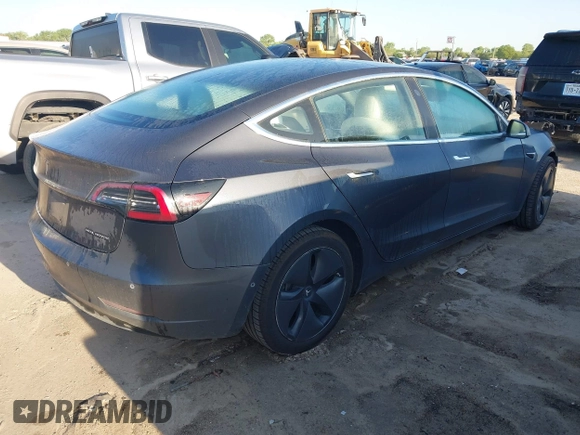 2018 Tesla Model 3 Long Range Battery with VIN 5YJ3E1EB0JF170215, listed as a IAAI auction lot 41969004 with 81,704 mi miles and . Bid and sale history available at DreamBid. Image 4.