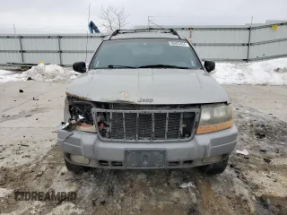 2000 Jeep Grand Cherokee Laredo z VIN 1J4GW48S8YC335926, wystawiony jako Copart lot #80693454 z przebiegiem 353 635 mil mil oraz Nie do naprawy • Non repairable. Historia ofert i sprzedaży dostępna na DreamBid. Obrazek 5.