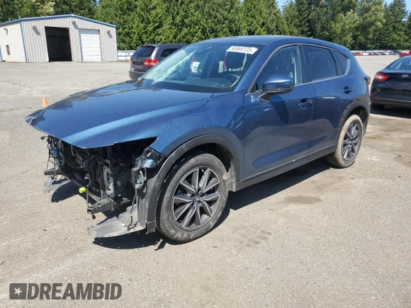 2018 Mazda CX-5 Touring z VIN JM3KFBCM2J1363310, wystawiony jako Copart lot #58969135 z przebiegiem 86 831 mil mil oraz Szkoda całkowita • Salvage title. Historia ofert i sprzedaży dostępna na DreamBid. Obrazek 1.
