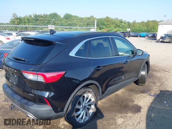 2021 Ford Escape Titanium Hybrid with VIN 1FMCU9DZ0MUB14833, listed as a IAAI auction lot 42593983 with 51,852 mi miles and . Bid and sale history available at DreamBid. Image 4.