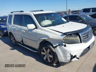 2012 Honda Pilot Touring with VIN 5FNYF3H91CB020673, listed as a IAAI auction lot 41721836 with 123,607 mi miles and . Bid and sale history available at carsss.com. Image 1.
