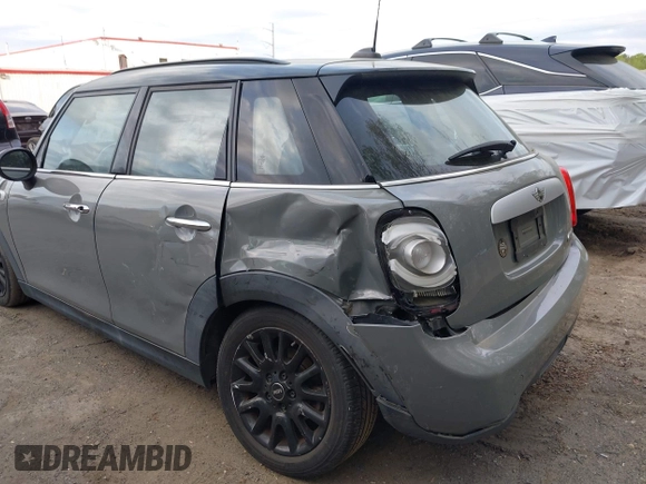 2015 MINI Hardtop 4 Door with VIN WMWXS5C57FT831660, listed as a IAAI auction lot 42057682 with 110,940 mi miles and . Bid and sale history available at DreamBid. Image 6.