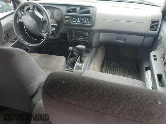 2000 Nissan Frontier XE with VIN 1N6ED27Y6YC334154, listed as a Copart auction lot 54140454 with 330,552 mi miles and Salvage title. Bid and sale history available at DreamBid. Image 8.