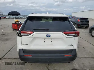 2023 Toyota RAV4 Hybrid LE with VIN JTMMWRFV3PD570648, listed as a Copart auction lot 86983174 with 27,258 mi miles and Salvage title. Bid and sale history available at DreamBid. Image 6.