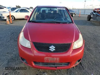 2013 Suzuki SX4 LE with VIN JS2YC5A37D6101819, listed as a Copart auction lot 82367044 with 142,932 mi miles and Salvage Title. Bid and sale history available at carsss.com. Image 5.