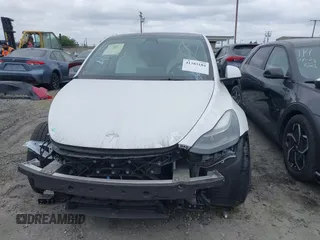 2023 Tesla Model Y Long Range z VIN 7SAYGDEE9PF623285, wystawiony jako IAAI lot #41383184 z przebiegiem 34 092 mil mil oraz . Historia ofert i sprzedaży dostępna na DreamBid. Obrazek 12.