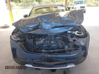 2023 Mazda CX-50 Premium Plus with VIN 7MMVABEY8PN100311, listed as a IAAI auction lot 42626276 with 40,242 mi miles and . Bid and sale history available at DreamBid. Image 6.