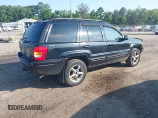 2001 Jeep Grand Cherokee Limited with VIN 1J4GW58NX1C685810, listed as a IAAI auction lot 42630490 with 441,046 mi miles and . Bid and sale history available at DreamBid. Image 4.