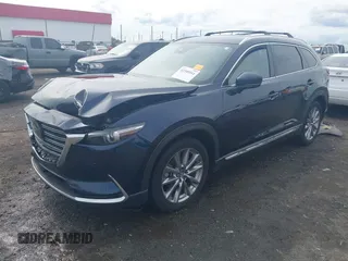 2020 Mazda CX-9 Grand Touring with VIN JM3TCBDY1L0402718, listed as a IAAI auction lot 42355511 with 87,205 mi miles and . Bid and sale history available at DreamBid. Image 18.