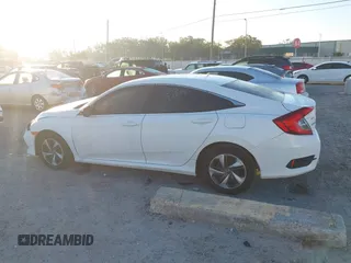 2019 Honda Civic LX with VIN 19XFC2F61KE014007, listed as a IAAI auction lot 41795070 with 64,259 mi miles and . Bid and sale history available at DreamBid. Image 14.