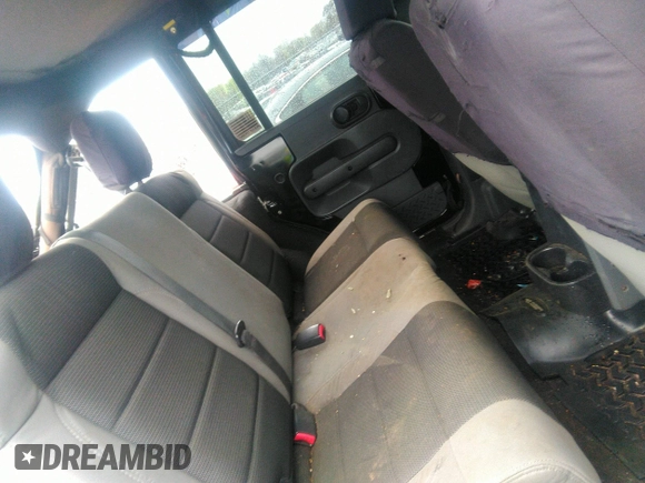 2007 Jeep Wrangler Unlimited X with VIN 1J4GA39177L147346, listed as a IAAI auction lot 41825501 with 163,027 mi miles and . Bid and sale history available at DreamBid. Image 8.