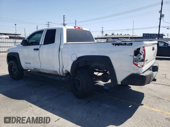 2014 Toyota Tundra SR z VIN 5TFUM5F10EX056473, wystawiony jako Copart lot #56758265 z przebiegiem 129 656 mil mil oraz Szkoda całkowita • Salvage title. Historia ofert i sprzedaży dostępna na DreamBid. Obrazek 2.
