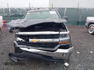 2018 Chevrolet Silverado 1500 LT with VIN 2GCVKREC6J1102304, listed as a IAAI auction lot 41800456 with 82,000 mi miles and . Bid and sale history available at DreamBid. Image 12.