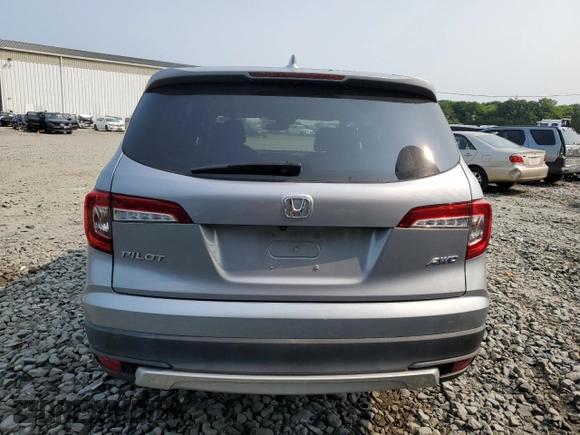 2020 Honda Pilot EX-L z VIN 5FNYF6H5XLB008097, wystawiony jako Copart lot #59329285 z przebiegiem Nie podano mil oraz Szkoda całkowita • Salvage title. Historia ofert i sprzedaży dostępna na DreamBid. Obrazek 6.