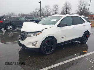2021 Chevrolet Equinox Premier z VIN 2GNAXNEV7M6112087, wystawiony jako IAAI lot #41102702 z przebiegiem 32 995 mil mil oraz . Historia ofert i sprzedaży dostępna na DreamBid. Obrazek 17.