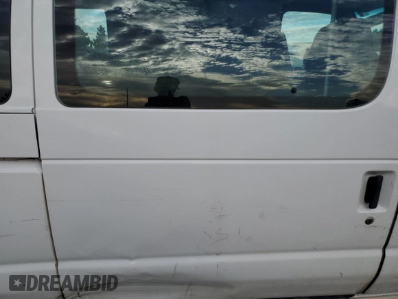 1999 Ford Econoline Passenger XL with VIN 1FBSS31L2XHA95612, listed as a Copart auction lot 72615104 with 211,283 mi miles and Salvage Title. Bid and sale history available at DreamBid. Image 11.