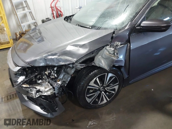 2018 Honda Civic EX-T with VIN JHMFC1F35JX031132, listed as a IAAI auction lot 41591028 with 111,087 mi miles and . Bid and sale history available at DreamBid. Image 6.