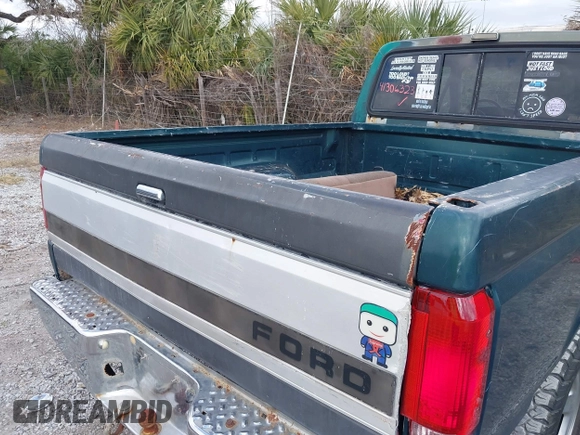 1993 Ford F-150 z VIN 1FTEX15N7PKB65960, wystawiony jako IAAI lot #41306323 z przebiegiem Nie podano mil oraz . Historia ofert i sprzedaży dostępna na DreamBid. Obrazek 16.