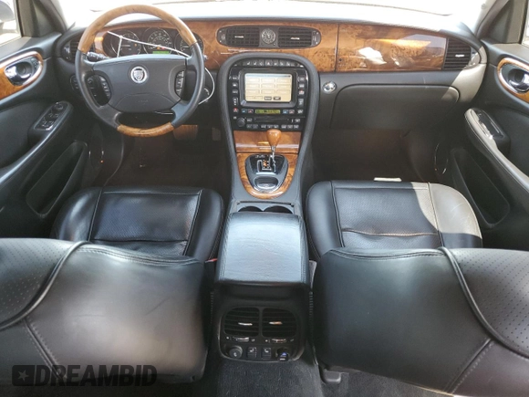 2009 Jaguar XJ 8 with VIN SAJWA71B79SH30431, listed as a Copart auction lot 52403185 with 67,143 mi miles and Salvage Title. Bid and sale history available at DreamBid. Image 8.