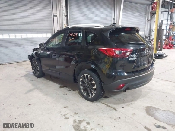 2016 Mazda CX-5 Grand Touring with VIN JM3KE2DY9G0635368, listed as a IAAI auction lot 41699616 with 240,619 mi miles. Bid and sale history available at carsss.com. Image 3.