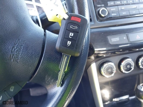 2016 Mitsubishi Lancer ES with VIN JA32U2FUXGU003461, listed as a IAAI auction lot 41804879 with 147,036 mi miles. Bid and sale history available at carsss.com. Image 11.