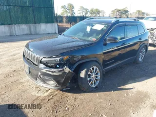 2019 Jeep Cherokee Latitude Plus with VIN 1C4PJMLB2KD261304, listed as a IAAI auction lot 41877500 with 76,442 mi miles and . Bid and sale history available at DreamBid. Image 21.