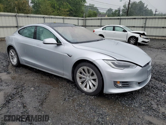2017 Tesla Model S 100D with VIN 5YJSA1E20HF190126, listed as a Copart auction lot 60087655 with 42,025 mi miles and Salvage title. Bid and sale history available at DreamBid. Image 4.