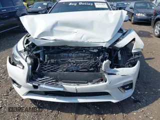 2019 Infiniti Q50 Luxe with VIN JN1EV7ARXKM557946, listed as a IAAI auction lot 40362058 with 56,615 mi miles and . Bid and sale history available at carsss.com. Image 12.