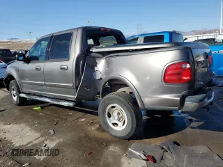 2003 Ford F-150 XLT with VIN 1FTRW08673KA38056, listed as a Copart auction lot 42772435 with 129,104 mi miles and Salvage Title. Bid and sale history available at carsss.com. Image 2.