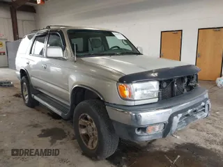 1999 Toyota 4Runner SR5 z VIN JT3HN86R8X0221532, wystawiony jako IAAI lot #41902556 z przebiegiem 406 602 mil mil oraz . Historia ofert i sprzedaży dostępna na DreamBid. Obrazek 1.