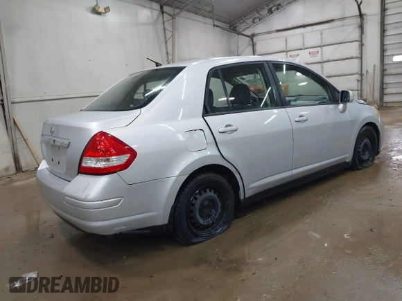 2011 Nissan Versa S with VIN 3N1BC1AP5BL465531, listed as a IAAI auction lot 42124083 with 249,641 mi miles and . Bid and sale history available at DreamBid. Image 4.