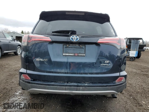 2018 Toyota RAV4 Hybrid SE with VIN JTMJJREV6JD225530, listed as a Copart auction lot 52000985 with 150,642 mi miles and Salvage title. Bid and sale history available at DreamBid. Image 6.