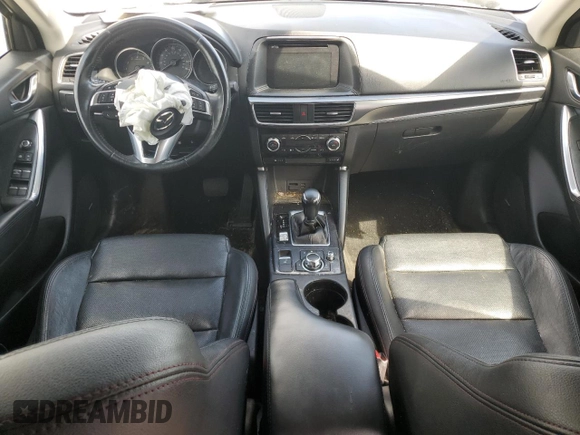 2016 Mazda CX-5 Grand Touring z VIN JM3KE2DY9G0645141, wystawiony jako Copart lot #50989635 z przebiegiem 123 898 mil mil oraz Szkoda całkowita • Salvage title. Historia ofert i sprzedaży dostępna na DreamBid. Obrazek 8.