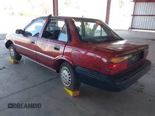 1990 Toyota Corolla z VIN 1NXAE94A1LZ117401, wystawiony jako IAAI lot #41755431 z przebiegiem 81 786 mil mil oraz . Historia ofert i sprzedaży dostępna na DreamBid. Obrazek 3.
