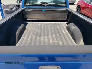 2000 Dodge Dakota z VIN 1B7FL26X5YS682973, wystawiony jako Copart lot #56680405 z przebiegiem 90 762 mil mil oraz Czysty tytuł • Clean title. Historia ofert i sprzedaży dostępna na DreamBid. Obrazek 10.
