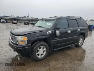 2001 GMC Yukon Denali z VIN 1GKEK63U71J294210, wystawiony jako Copart lot #42487165 z przebiegiem Nie podano mil oraz Szkoda całkowita • Salvage title. Historia ofert i sprzedaży dostępna na DreamBid. Obrazek 1.