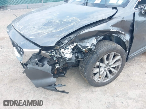 2016 Mazda CX-9 Grand Touring with VIN JM3TCBDY3G0117802, listed as a IAAI auction lot 42150821 with 157,760 mi miles and . Bid and sale history available at DreamBid. Image 6.