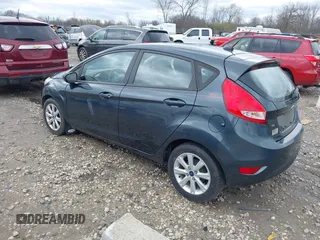2011 Ford Fiesta SE with VIN 3FADP4EJ4BM228417, listed as a IAAI auction lot 42061494 with 86,873 mi miles. Bid and sale history available at carsss.com. Image 3.