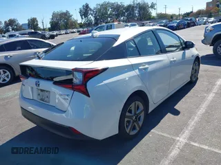 2020 Toyota Prius L Eco with VIN JTDKARFUXL3107211, listed as a IAAI auction lot 42797561 with 328,023 mi miles and . Bid and sale history available at DreamBid. Image 4.
