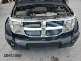 2007 Dodge Nitro SXT z VIN 1D8GU28K47W731172, wystawiony jako Copart lot #59954825 z przebiegiem 121 455 mil mil oraz Szkoda całkowita • Salvage title. Historia ofert i sprzedaży dostępna na DreamBid. Obrazek 11.