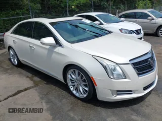 2014 Cadillac XTS Platinum z VIN 2G61W5S83E9165236, wystawiony jako IAAI lot #42423952 z przebiegiem 165 753 mil mil oraz . Historia ofert i sprzedaży dostępna na DreamBid. Obrazek 1.