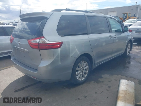 2015 Toyota Sienna XLE with VIN 5TDYK3DC2FS640204, listed as a IAAI auction lot 41772349 with 104,156 mi miles. Bid and sale history available at carsss.com. Image 4.
