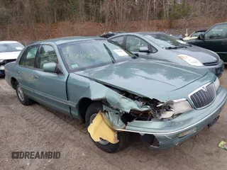 1997 Mercury Grand Marquis GS z VIN 2MELM74W5VX732849, wystawiony jako IAAI lot #41791813 z przebiegiem 175 686 mil mil oraz . Historia ofert i sprzedaży dostępna na DreamBid. Obrazek 1.