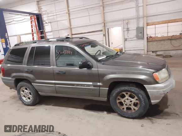 2000 Jeep Grand Cherokee Laredo z VIN 1J4GW48S1YC277710, wystawiony jako IAAI lot #42033564 z przebiegiem Nie podano mil oraz . Historia ofert i sprzedaży dostępna na DreamBid. Obrazek 13.