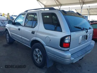 2001 Isuzu Rodeo S with VIN 4S2CK58W614361048, listed as a IAAI auction lot 41681566 with 133,460 mi miles and . Bid and sale history available at DreamBid. Image 3.