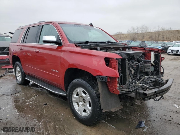 2015 Chevrolet Tahoe LTZ with VIN 1GNSKCKC8FR133323, listed as a Copart auction lot 47989525 with 123,391 mi miles and Salvage Title. Bid and sale history available at carsss.com. Image 4.