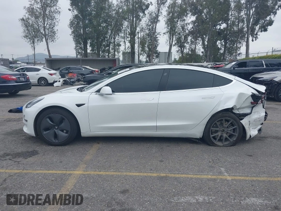 2020 Tesla Model 3 Long Range with VIN 5YJ3E1EB0LF803217, listed as a IAAI auction lot 41871940 with 130,391 mi miles. Bid and sale history available at carsss.com. Image 14.