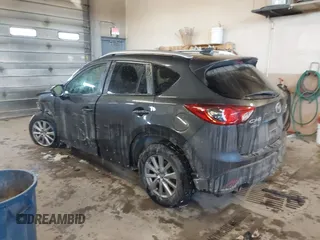 2015 Mazda CX-5 Touring with VIN JM3KE2CY2F0458114, listed as a IAAI auction lot 41545493 with 138,061 mi miles. Bid and sale history available at carsss.com. Image 3.